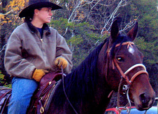 Pine River Stable guide sitting on one of the 130 horses.